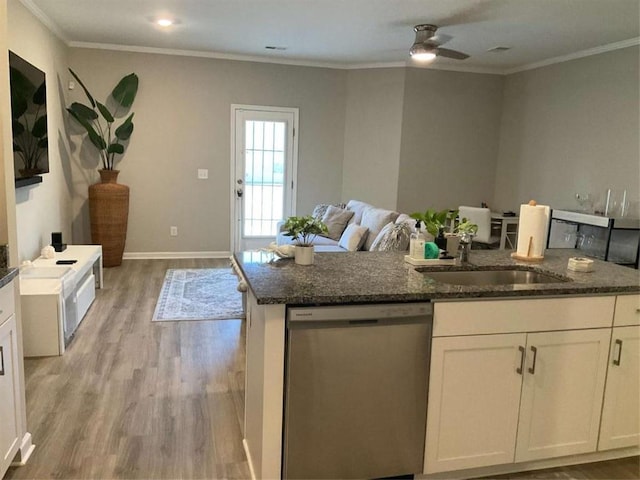 kitchen featuring white cabinets, dishwasher, sink, light wood-type flooring, and crown molding