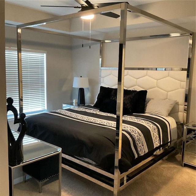 bedroom featuring ceiling fan and carpet flooring