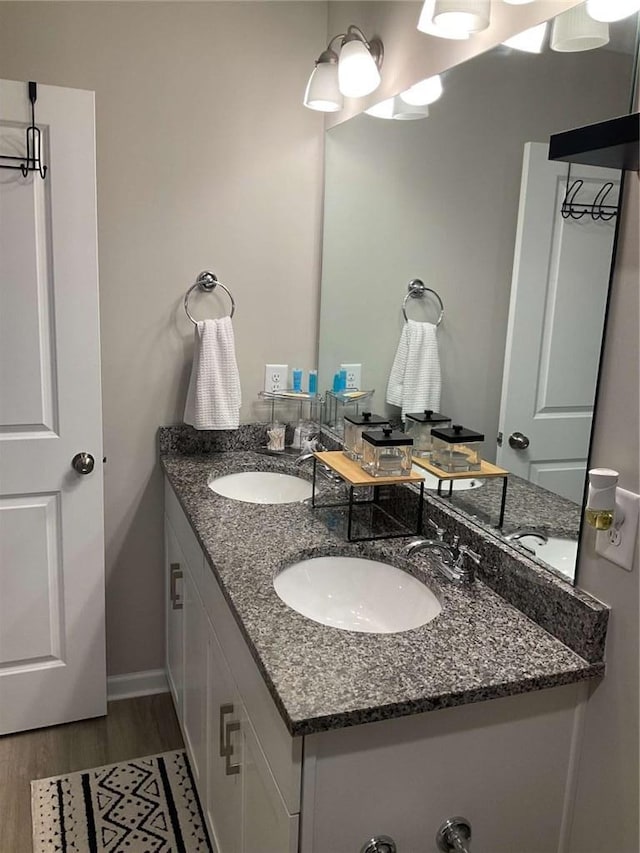 bathroom with wood-type flooring and vanity