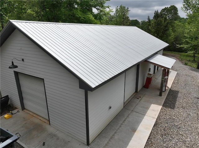 view of side of property with metal roof