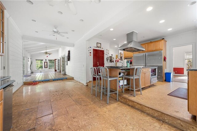6048 Kings Mountain Way, Tucker, GA 30087 - kitchen featuring open floor plan, island exhaust hood, ceiling fan, and a wealth of natural light
