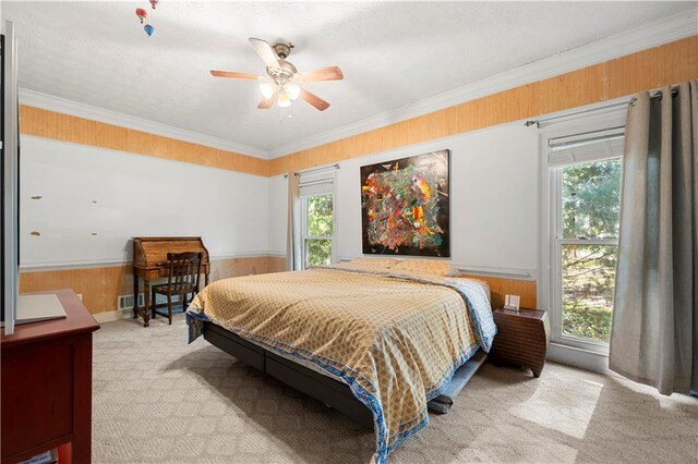 6048 Kings Mountain Way, Tucker, GA 30087 - bedroom featuring crown molding, ceiling fan, light colored carpet, a wainscoted wall, and wooden walls
