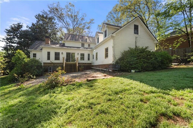 6048 Kings Mountain Way, Tucker, GA 30087 - rear view of house with a chimney and a lawn