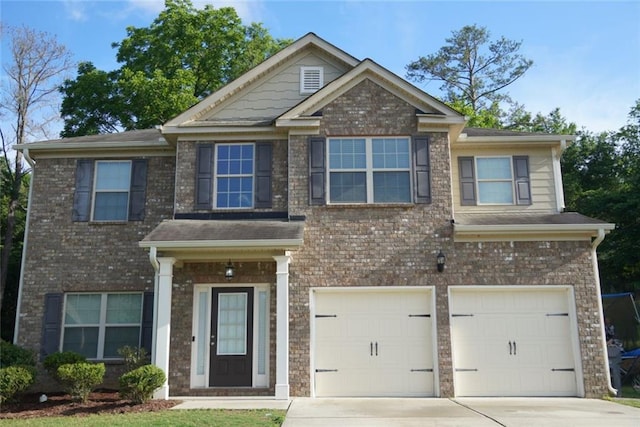 1504 Gallup Dr, Stockbridge, GA 30281 - craftsman-style home with driveway, a garage, and brick siding