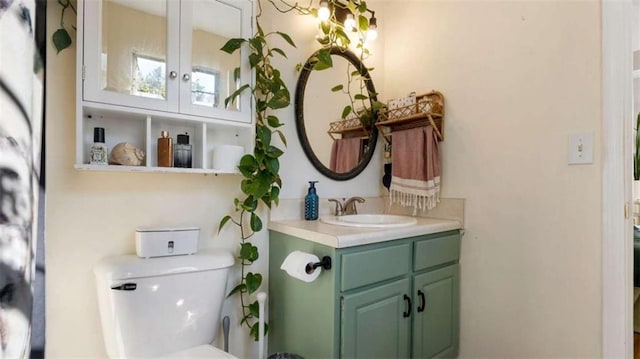 bathroom featuring toilet and vanity