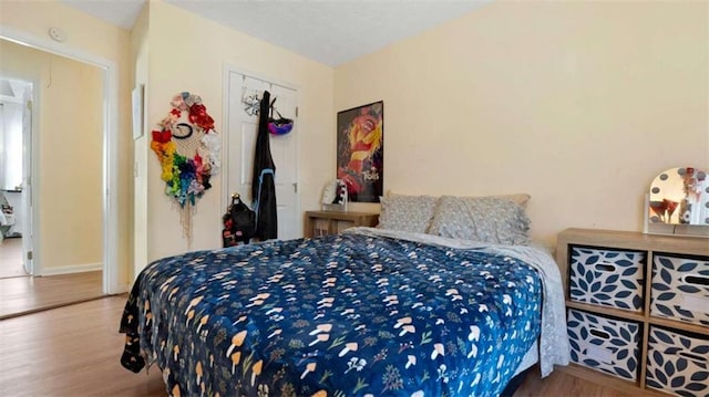 bedroom featuring wood finished floors