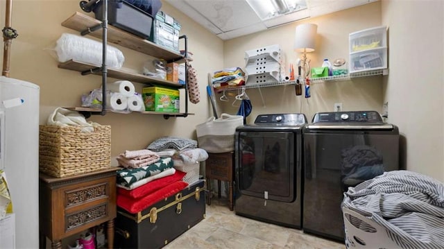 washroom featuring laundry area and washing machine and dryer