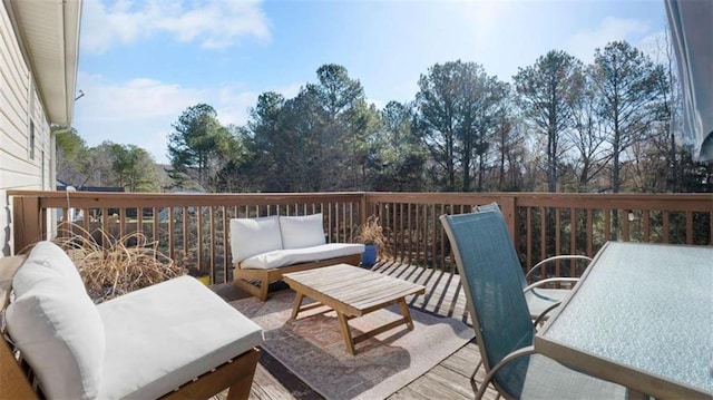 wooden deck featuring an outdoor hangout area