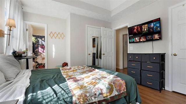 bedroom featuring a closet and wood finished floors