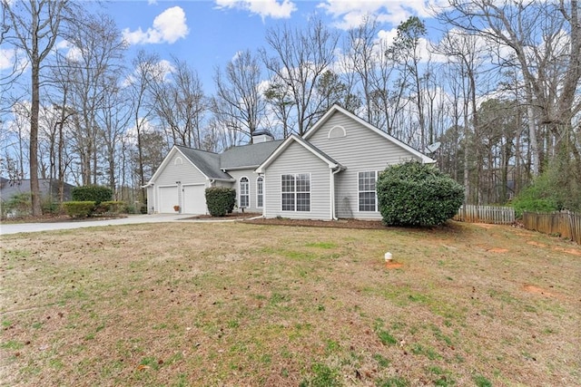 ranch-style home featuring an attached garage, fence, driveway, a front lawn, and a chimney