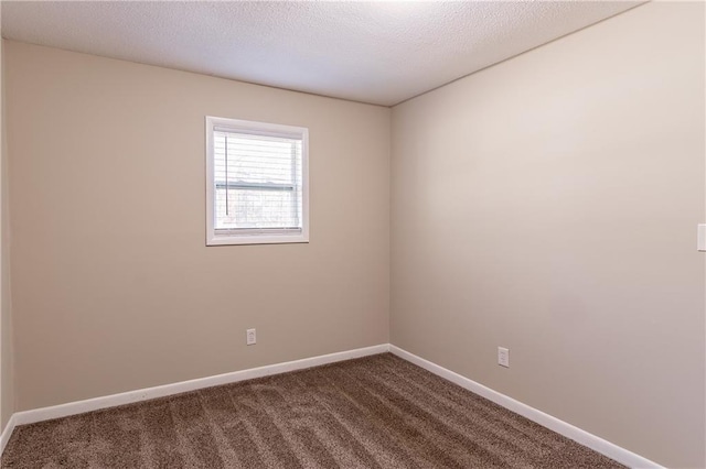 empty room featuring carpet floors