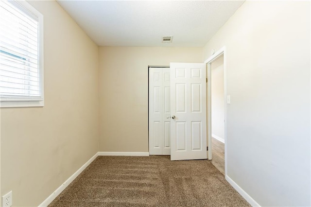 empty room featuring carpet floors