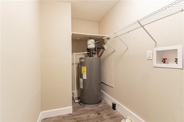 utility room with electric water heater