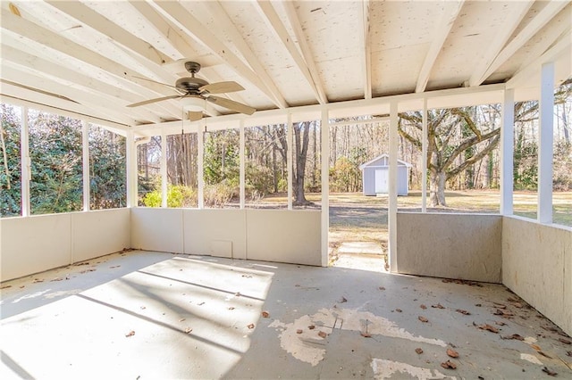 unfurnished sunroom with ceiling fan