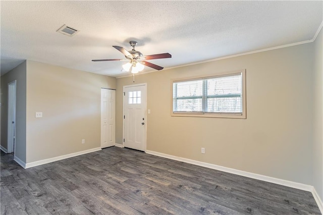 foyer featuring a textured ceiling, dark hardwood / wood-style floors, ceiling fan, and crown molding