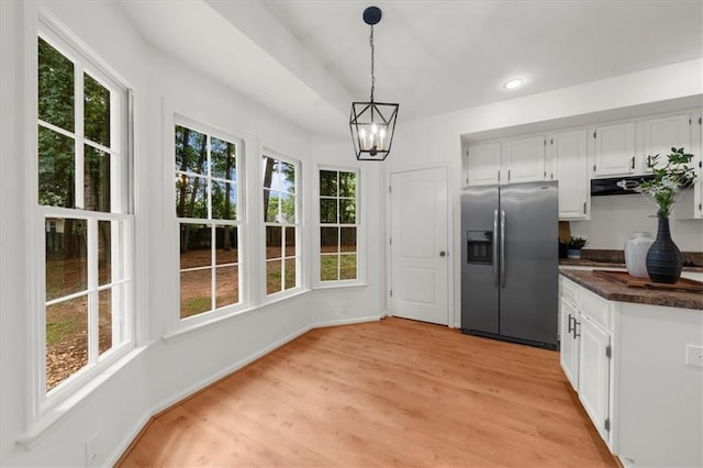 11660 Windbrooke Way, Johns Creek, GA 30005 - kitchen featuring stainless steel fridge with ice dispenser, dark countertops, plenty of natural light, white cabinetry, and recessed lighting