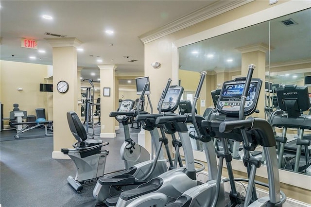 exercise room featuring crown molding