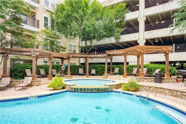 view of pool featuring a community hot tub and a pergola