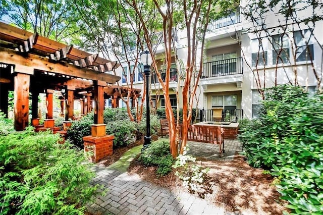 view of home's community with a pergola