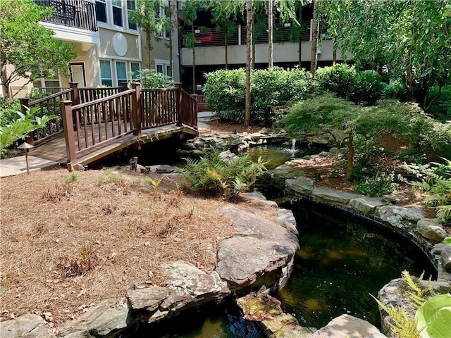 view of yard with a small pond