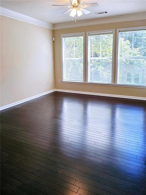 unfurnished room with dark hardwood / wood-style flooring, ceiling fan, and ornamental molding