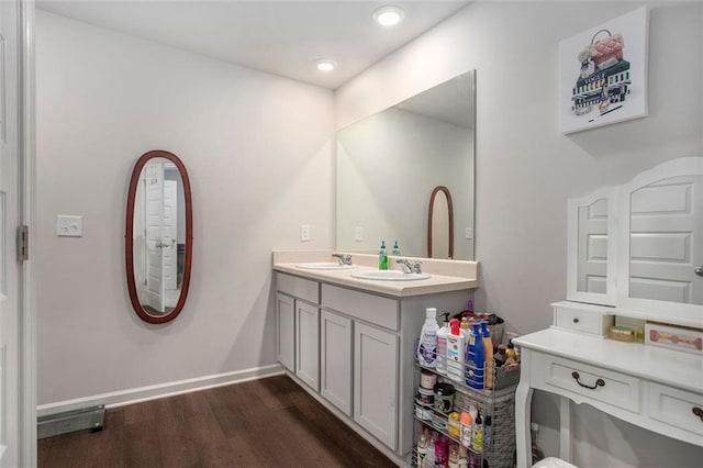 bathroom with vanity and hardwood / wood-style floors