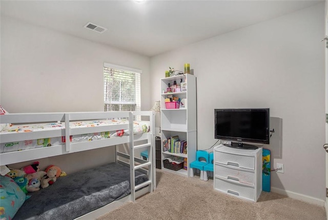 bedroom featuring light colored carpet