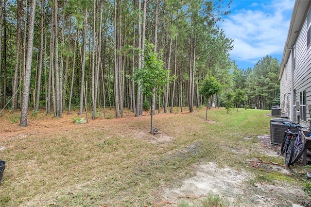 view of yard featuring central air condition unit