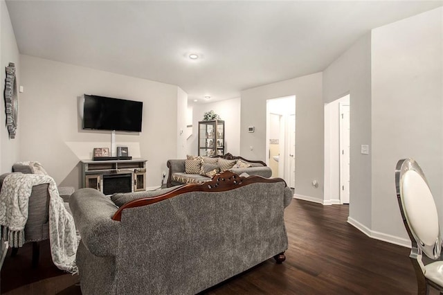 living room featuring dark hardwood / wood-style flooring