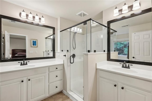 bathroom with walk in shower and vanity