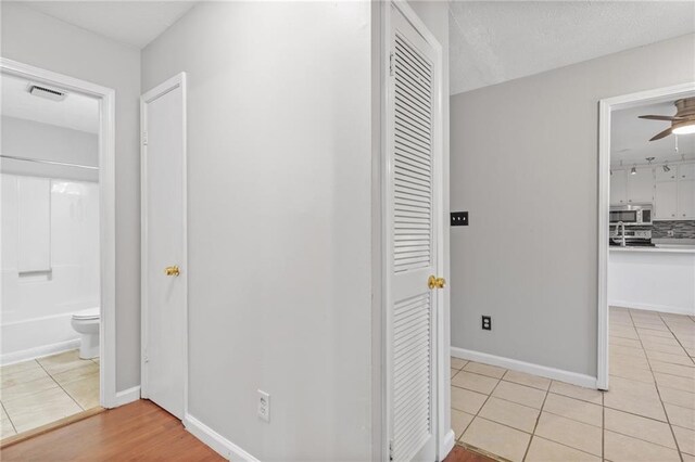 hallway with light tile patterned flooring