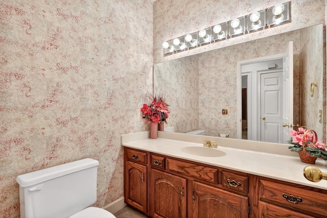 3185 Country Club Ct NW, Kennesaw, GA 30144 - bathroom with wallpapered walls, vanity, toilet, and baseboards