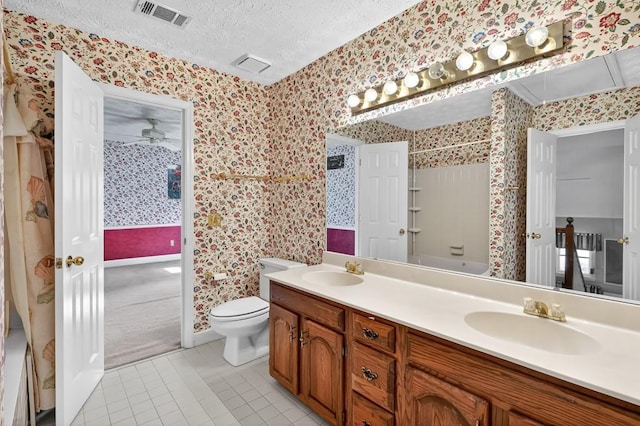 3185 Country Club Ct NW, Kennesaw, GA 30144 - full bathroom featuring wallpapered walls, double vanity, tile patterned flooring, toilet, and a textured ceiling
