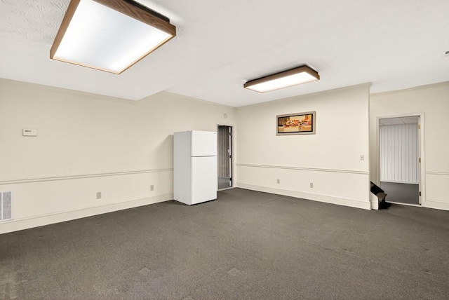 3185 Country Club Ct NW, Kennesaw, GA 30144 - below grade area featuring freestanding refrigerator, dark colored carpet, and baseboards