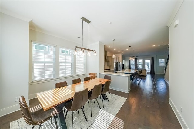 dining space featuring baseboards, dark wood-style flooring, recessed lighting, and crown molding