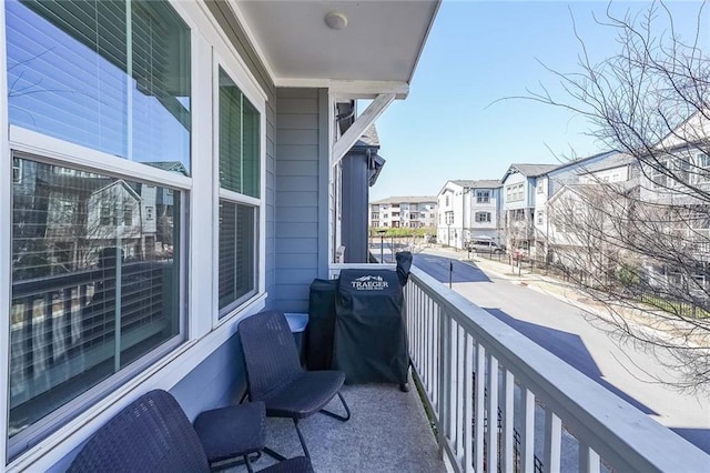 balcony featuring a residential view and grilling area