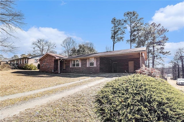 ranch-style house with a carport