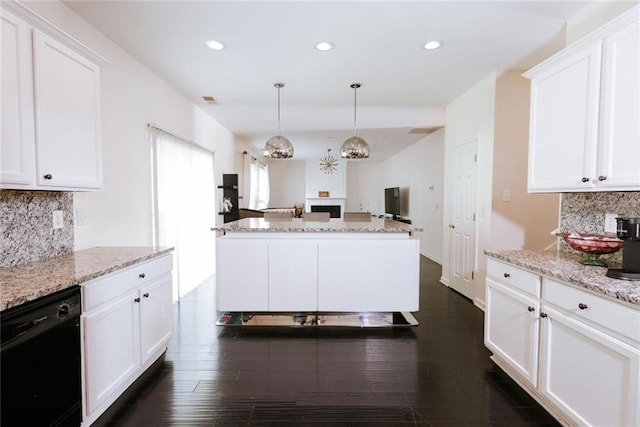 kitchen featuring dishwasher, tasteful backsplash, and white cabinetry