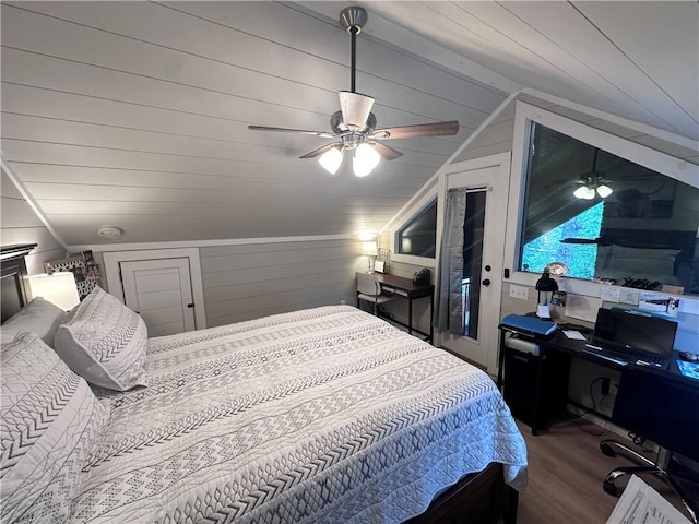 bedroom featuring ceiling fan, vaulted ceiling, wooden walls, and wood-type flooring