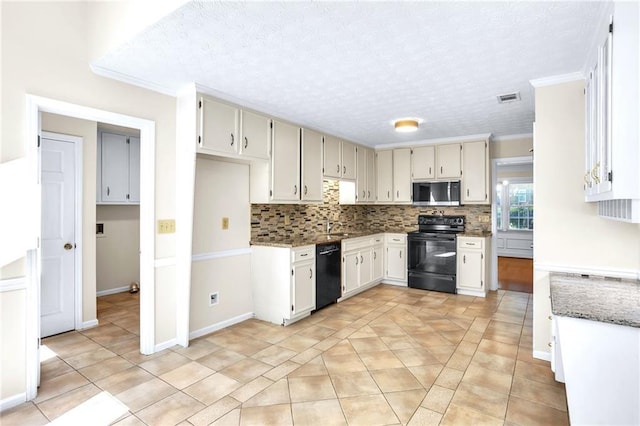 kitchen featuring black appliances, backsplash, ornamental molding, stone counters, and a textured ceiling