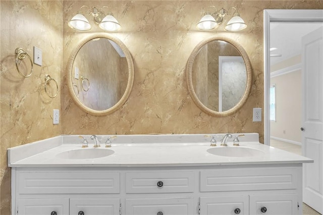 bathroom featuring double vanity and crown molding