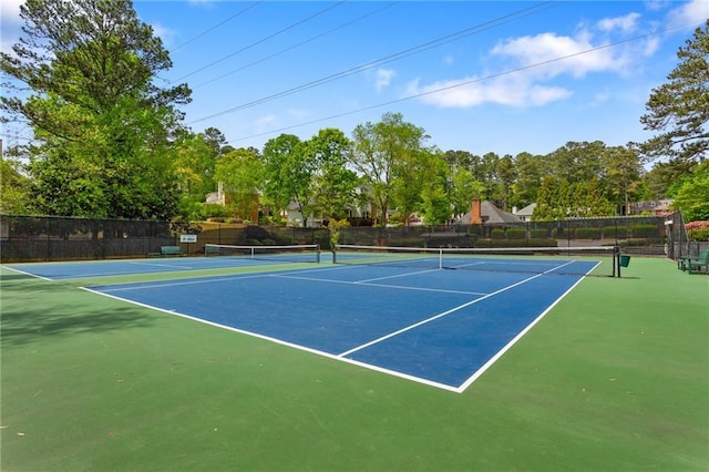 view of tennis court with community basketball court