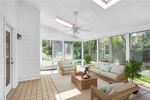 sunroom / solarium with a skylight, a ceiling fan, vaulted ceiling, and outdoor lounge area