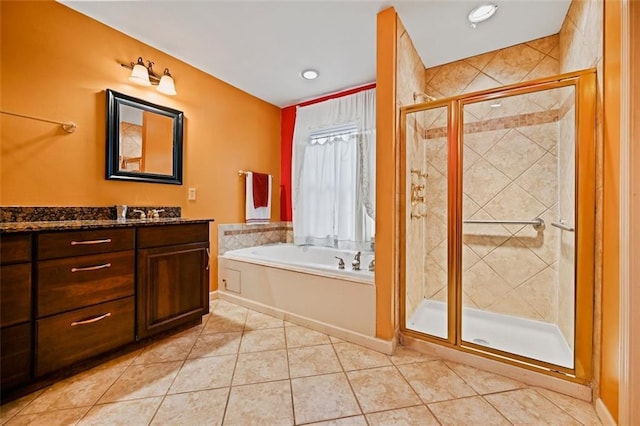 bathroom with vanity, shower with separate bathtub, and tile patterned flooring