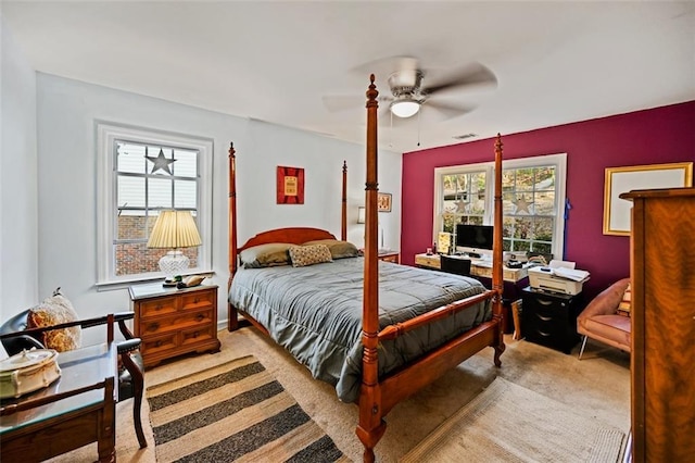 bedroom featuring light carpet and ceiling fan