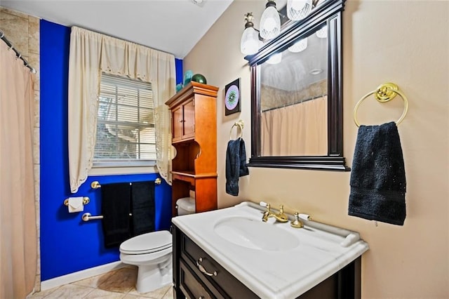 bathroom with walk in shower, tile patterned floors, vanity, and toilet