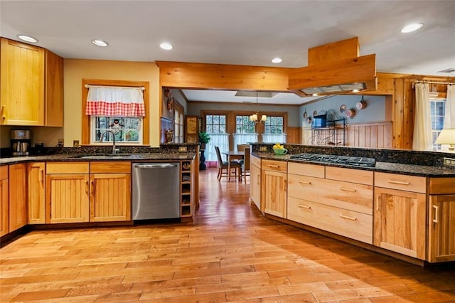 kitchen with sink, light hardwood / wood-style floors, decorative light fixtures, black gas stovetop, and stainless steel dishwasher