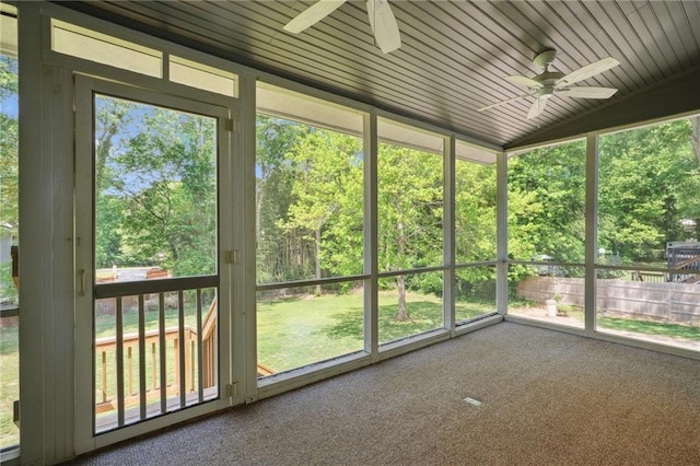 unfurnished sunroom with ceiling fan and a wealth of natural light