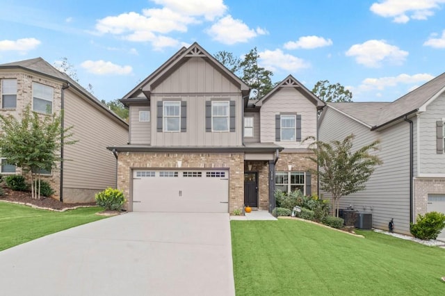 craftsman-style home featuring a front lawn, cooling unit, and a garage