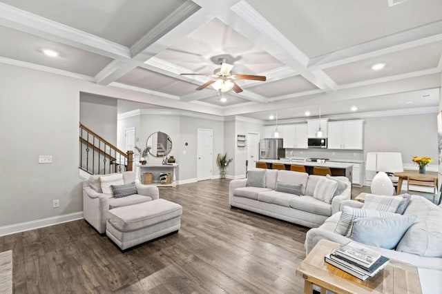 living room with dark wood-type flooring, crown molding, coffered ceiling, and beam ceiling